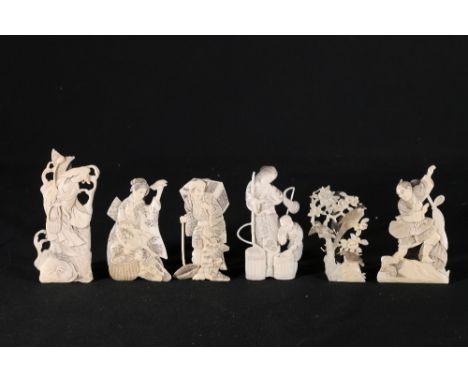 Set of six Japanese ivory flat panel carvings of figures birds and flowers, each with white metal easel stands, 8cm - 11cm Me
