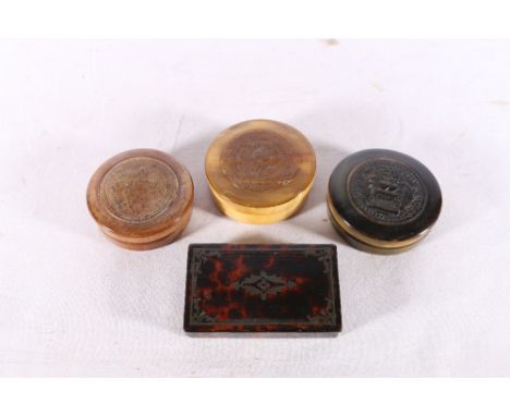 Three circular horn snuff boxes, one carved with "huma so prizao dois coracoens unidos fazem", also a rectangular snuff box, 
