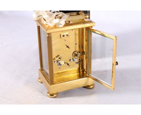 French carriage clock, the white enamel dial with Roman numeral chapter ring and subsidiary seconds dial, 18cm tall with oute