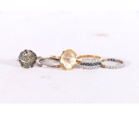 White metal diamond set eternity ring, size N/O, 2.1g, a 9ct gold faceted citrine set dress ring, size P, 4.1g and three othe