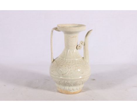 Chinese Qingbai style ewer with relief scroll decoration to the body and reeded handle, 20cm. 