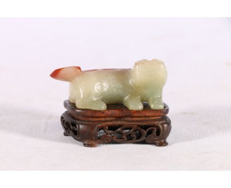 Chinese early 20th Century jade carving of a lion dog in grey and russet, incised detail to the back and tail, 5.5cm carved a