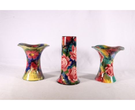 Three Wemyss Ware vases, one of inverted trumpet form decorated with roses, painted pattern number 213 to base and impressed 
