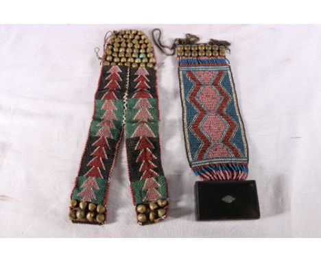 Two late 19th century Zulu beaded and brass bead embellished breast and waist ornaments, one with attached snuff box (2) 