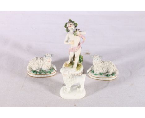 Continental porcelain figure of a boy with grapes, blue painted "R" mark to base, 11cm tall, a pair of Sitzendorf sheep and a