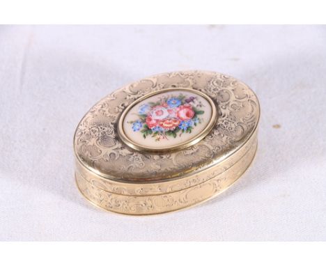 French style gilt metal patch box with allover engraved foliate scroll decoration and on set floral vignette to the top cover