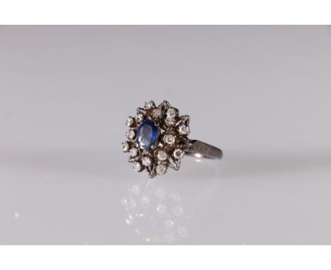 White metal diamond and sapphire set cluster ring, size O, 6.6g Its not stamped. 