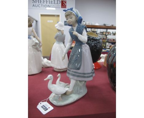 A Lladro Figurine of Girl Following Geese, stamped 5202, B-12D, 26.5cm high.