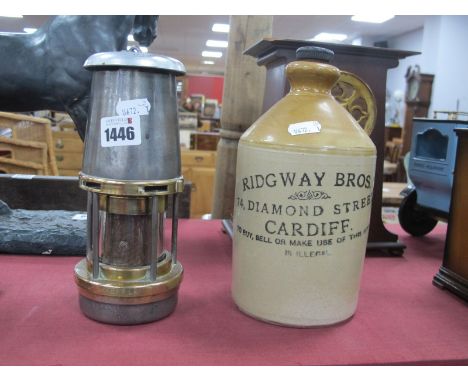 The Wolf Safety Lamp Co ( Wm Maurice Ltd) Sheffield Miners Lamp, together with a stoneware bottle. Ridgeway Brothers, 74 Diam