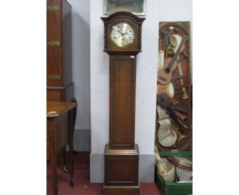 A 1930's Oak Musical Grandmother Clock, with a circular dial, the trunk with beadwork decoration, plinth base, bun feet, 130c