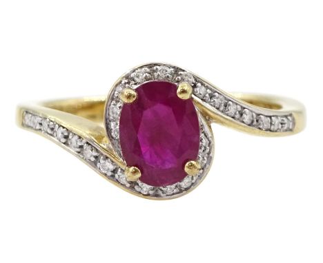 Gold oval cut ruby and round brilliant cut diamond crossover ring, hallmarked 9ctCondition Report:Approx 3.3gm, size P  