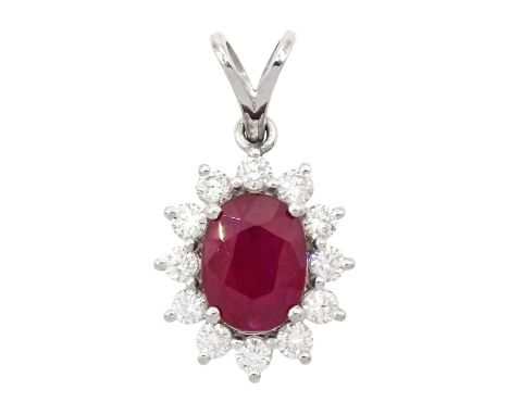 18ct white gold oval cut ruby and round brilliant cut diamond cluster pendant, ruby approx 0.75 carat, total diamond weight a