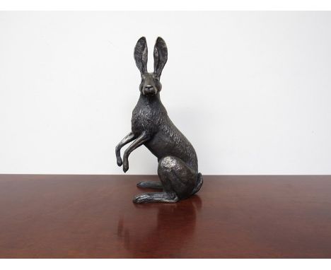 A large resin bronze hare on hind legs 29cm tall