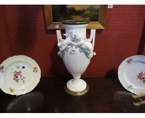 A French white ceramic vase, twin handle with putti and swags , 42cm tall