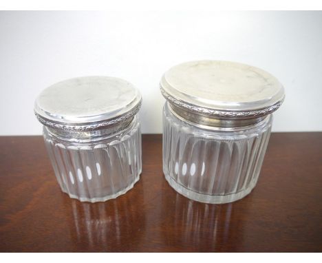 Two Sterling silver top dressing table containers with engine turned detailed, marked Zettel & Kohler 