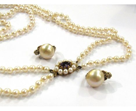 A double strand pearl necklace with amethyst and pearl clasp and a pair of pearl and marcasite stud earrings 
