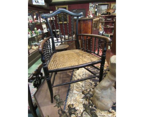 A late Victorian mahogany bobbin turned carver chair with cane seat 