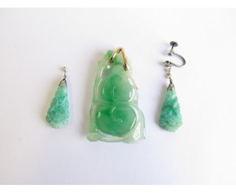 A late 20th Century carved and pierced jade pendant (small chips). A pair of early 20th Century jade effect earrings a/f