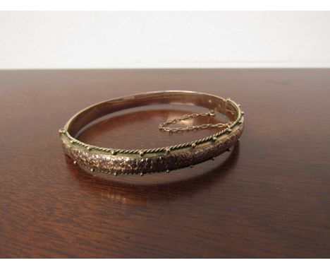 A 9ct gold bangle 