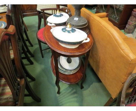 An Edwardian inlaid mahogany two tier lamp table the oval top on cabriole legs  