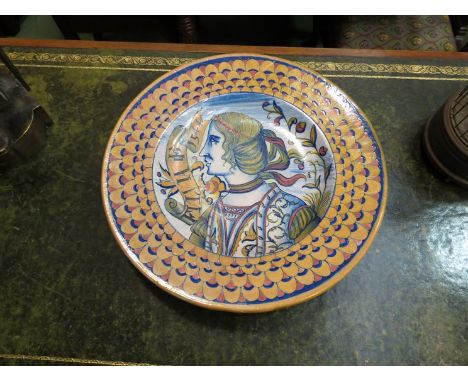 A charger depicting portrait of side facing gentleman with decorative rim, 37cm diameter
