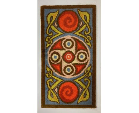 A polychrome Celtic Revival wool Rug, with typical Celtic design, inside a brown border, 178cms x 94cms (70" x 37"). (1) 
