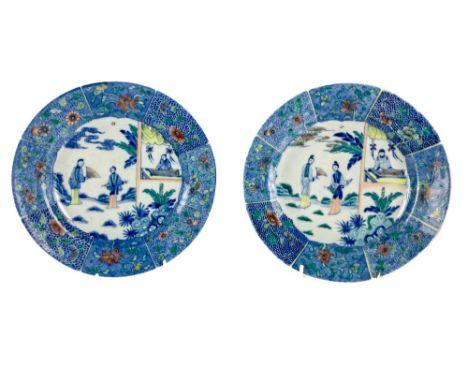 A pair of attractive 18th Century Doucai Plates, Kangxi period, the central panels with figures in landscape, the panelled bl