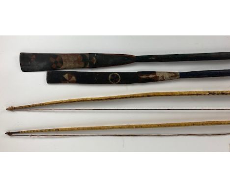 Two wooden Hunting Long Bows,&nbsp;each with plaited or basket weave cover, probably Solomon Islands, 142cms (56") together w