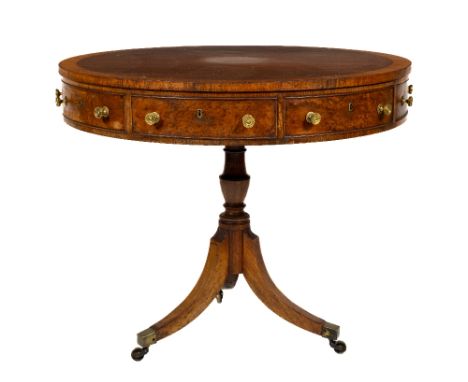 A good Regency style birds-eye-maple and rosewood banded Library Drum Table, with mock and two frieze drawers on a turned ste