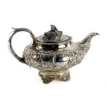 A William IV period silver Tea Service, London 1834 by G.H., the Teapot with embossed decoration