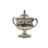 A fine Chester cast silver two handled Cup and Cover,  pierced with scrolling foliage and overlaid