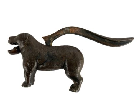 A heavy bronze Novelty Table Nut Cracker,&nbsp;modelled as a dog, with hinged tail mechanism. (1) 