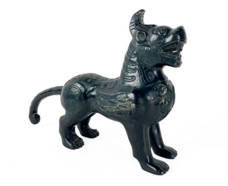 A Chinese bronze Figure of a Foo Lion, with snarling mouth and scrolling tail, 30cms (12"). (1) 