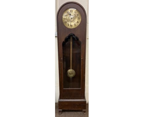 An early 20th Century Longcase walnut Clock, with arched top and circular brass dial with Arabic numerals above a glazed door