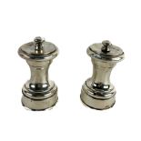 An Edwardian silver Salt and Pepper,  by John Grinsell & Sons, London, clear marks. (2)