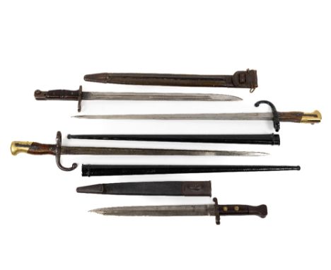 Militaria: A pair of 19th Century French Long Bayonets, each inscribed and dated 1876/1876, in steel scabbard (painted black)