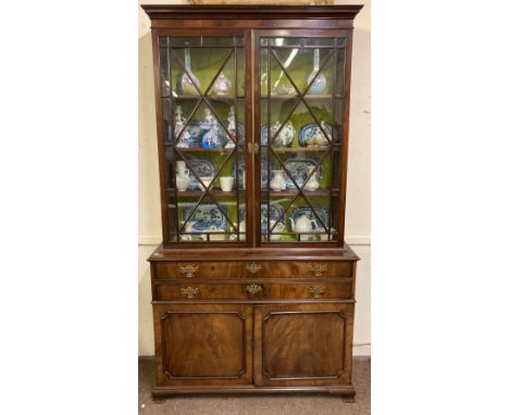 A very good George III period mahogany Bookcase, the moulded cornice above two diamond glazed doors&nbsp; on a base with two 