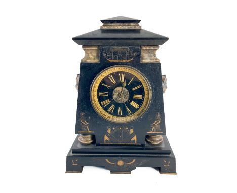 A late Victorian Egyptian Revival polished slate Mantle Clock, with bronze mask mounts, the parcel gilt black dial with Roman