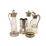 Three similar cutglass Claret Jugs, each with ornate silver plated mounts, all approx. 30cms (12")
