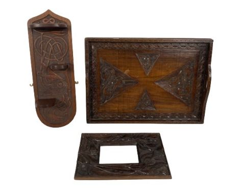 A rectangular carved Celtic Revival wooden Tray, with gallery and two cut out handles, 58cms (23"), a carved Arts &amp; Craft