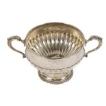 A heavy half fluted silver two handled Trophy Bowl, on circular stem base by the Goldsmiths &