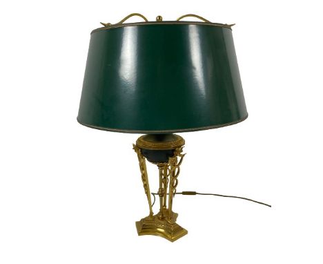 A French Empire style brass Table Lamp, modelled with three caduceus on tri-form moulded base, with green shade, 61cms (24").