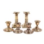 A pair of attractive silver Corinthian column design Bachelor Candlesticks, the shaped tops with