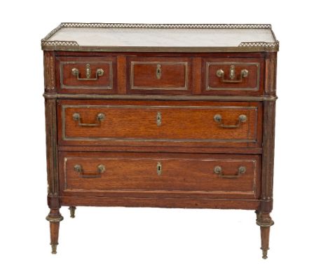 A 19th Century French Commode Chest, the white marble top with pierced brass gallery over three long drawers with brass drop 