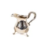 A heavy Victorian Irish crested silver baluster shaped Cream Jug, Dublin 1839 with heavy leaf cast