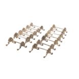 A set of 13 ornate silver plated Carver Stands, with floral decoration and paw feet, as a lot. (13)