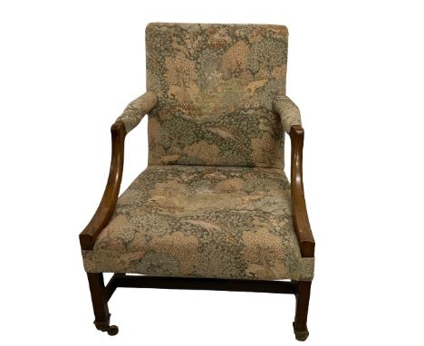 A good Georgian mahogany Gainsborough style Library Armchair, with padded back, seat and elbow rests covered in ornate tapest