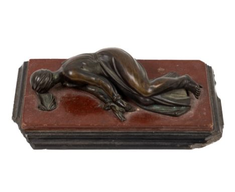 A 19th Century bronze and marble Paperweight, depicting a young lady resting on a rouge marble and slate stepped base (some c