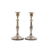 A pair of 19th Century Sheffield plated Table Candlesticks, each with a reeded baluster stem,