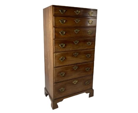 A fine quality Irish mahogany Provincial Tallboy, the plain top over seven graduating drawers with ornate brass handles and m